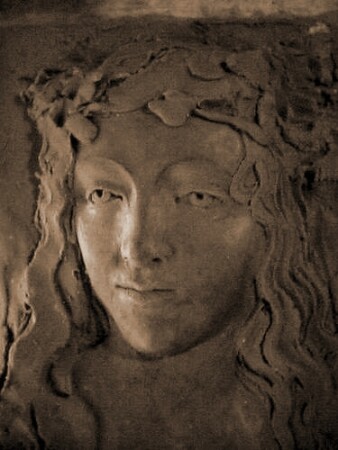 Girl with the grape leaves in her hairs