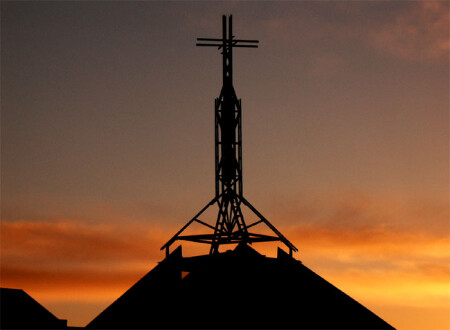 By the cross