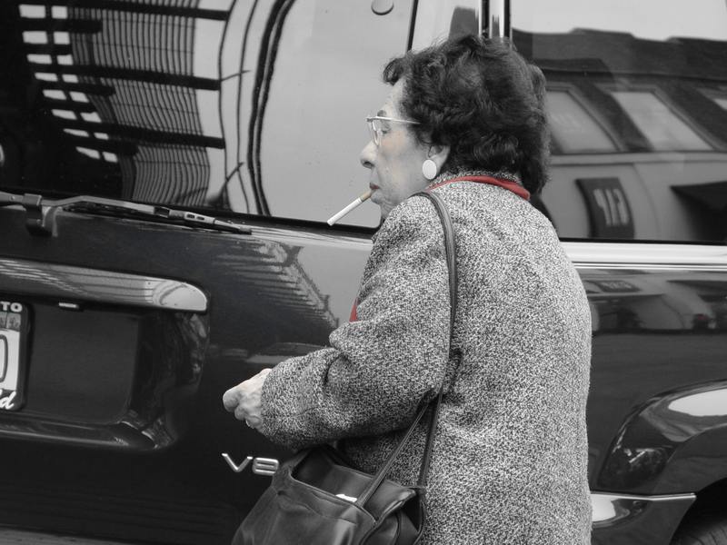 The old lady is smoking