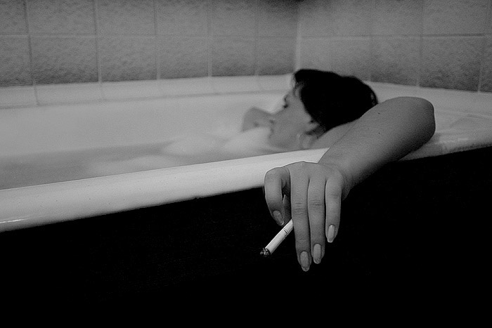 woman in bath (to smoke a cigarette)
