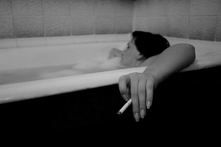 woman in bath (to smoke a cigarette)