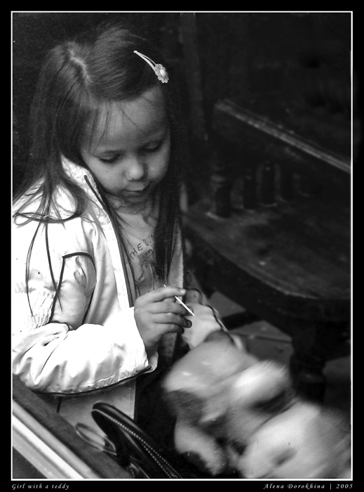 Girl with a teddy