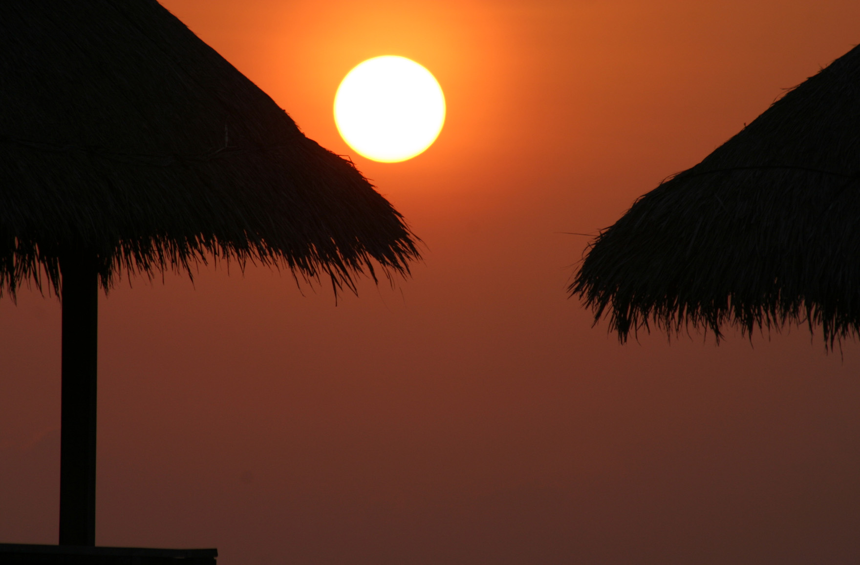 lazy sun on a roof of straw