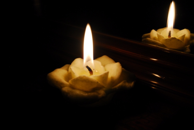 Candle in a mirror