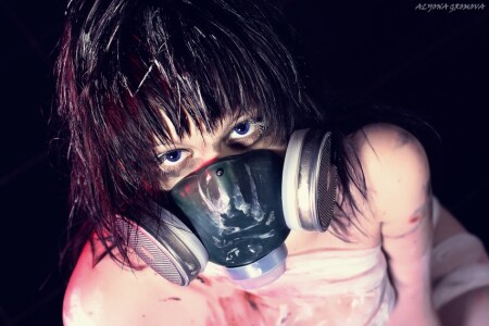 Behind a gas mask
