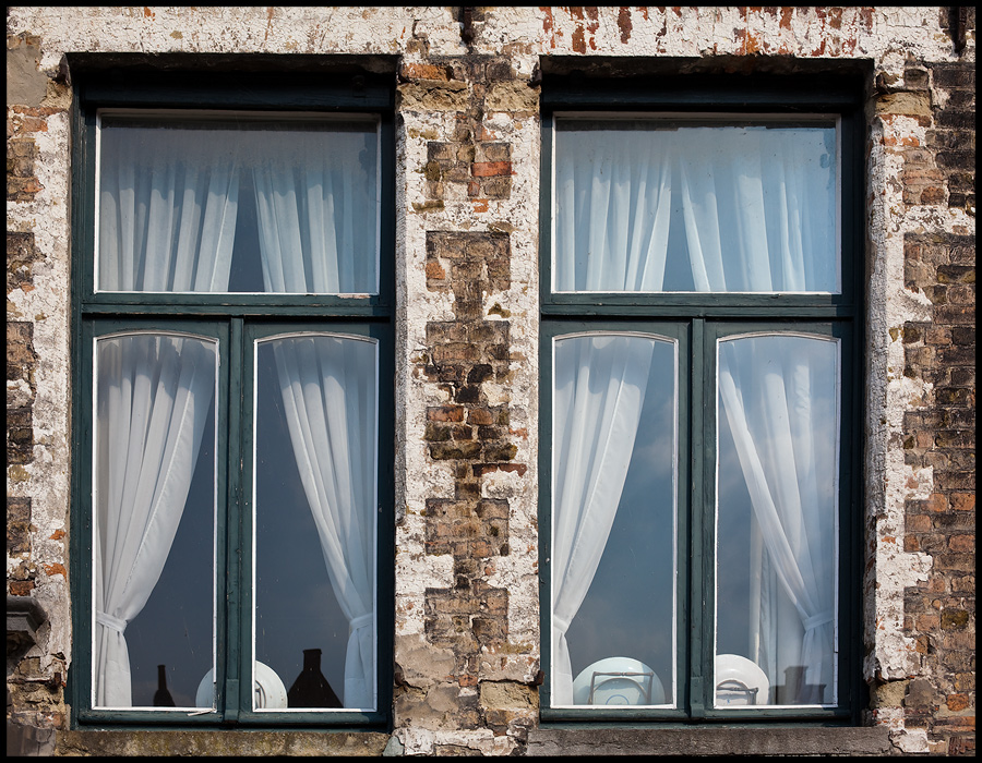 ...bright curtains would tone up this dull room...