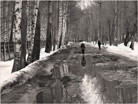 По лужам.