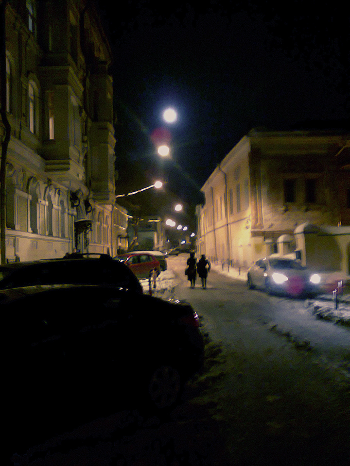 just the night shot with moon above lanterns